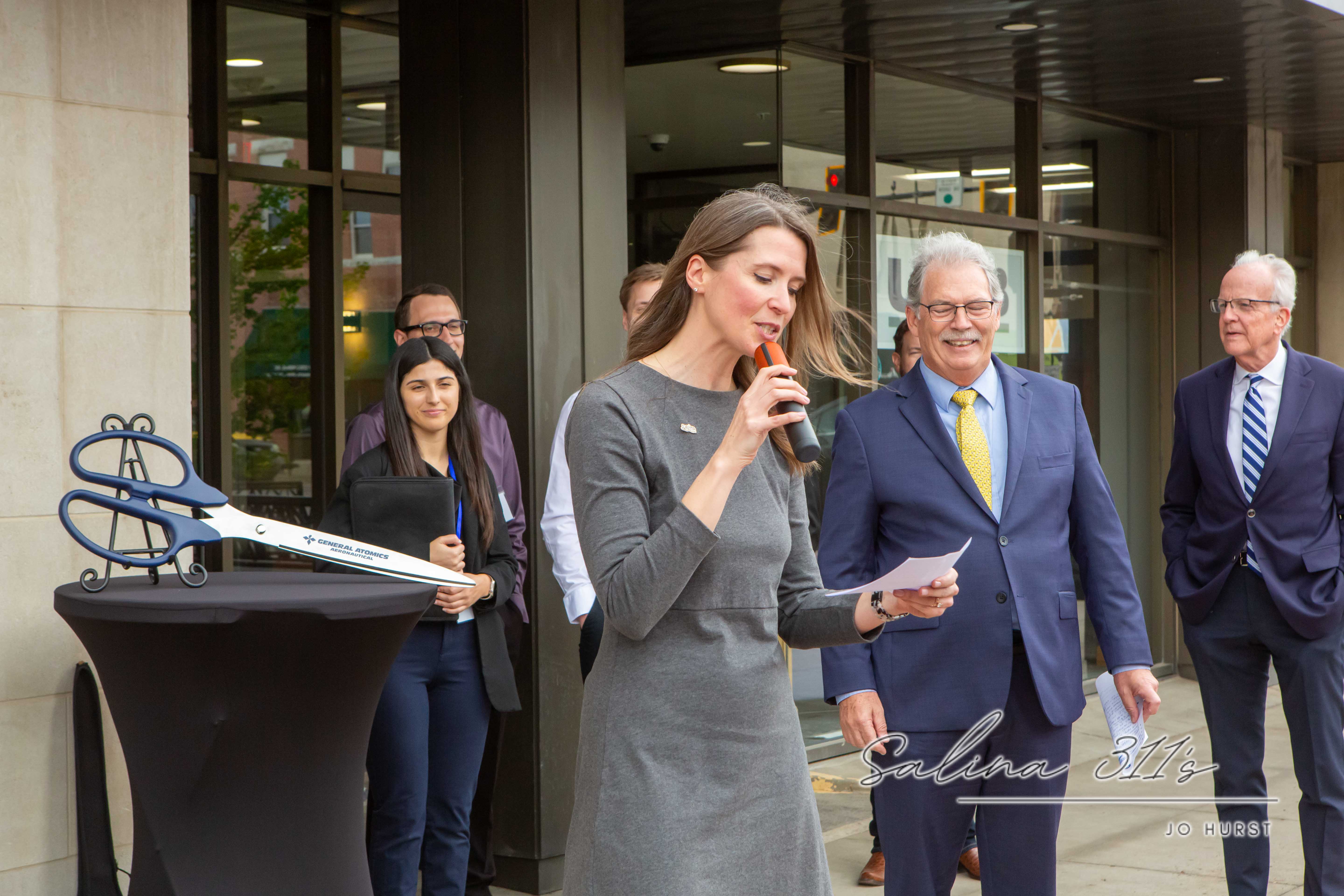 Salina Area Chamber CEO Renee Duxler at Thursday’s ribbon cutting for General Atomics Aeronautical Systems, Inc.’s new downtown Salina office.