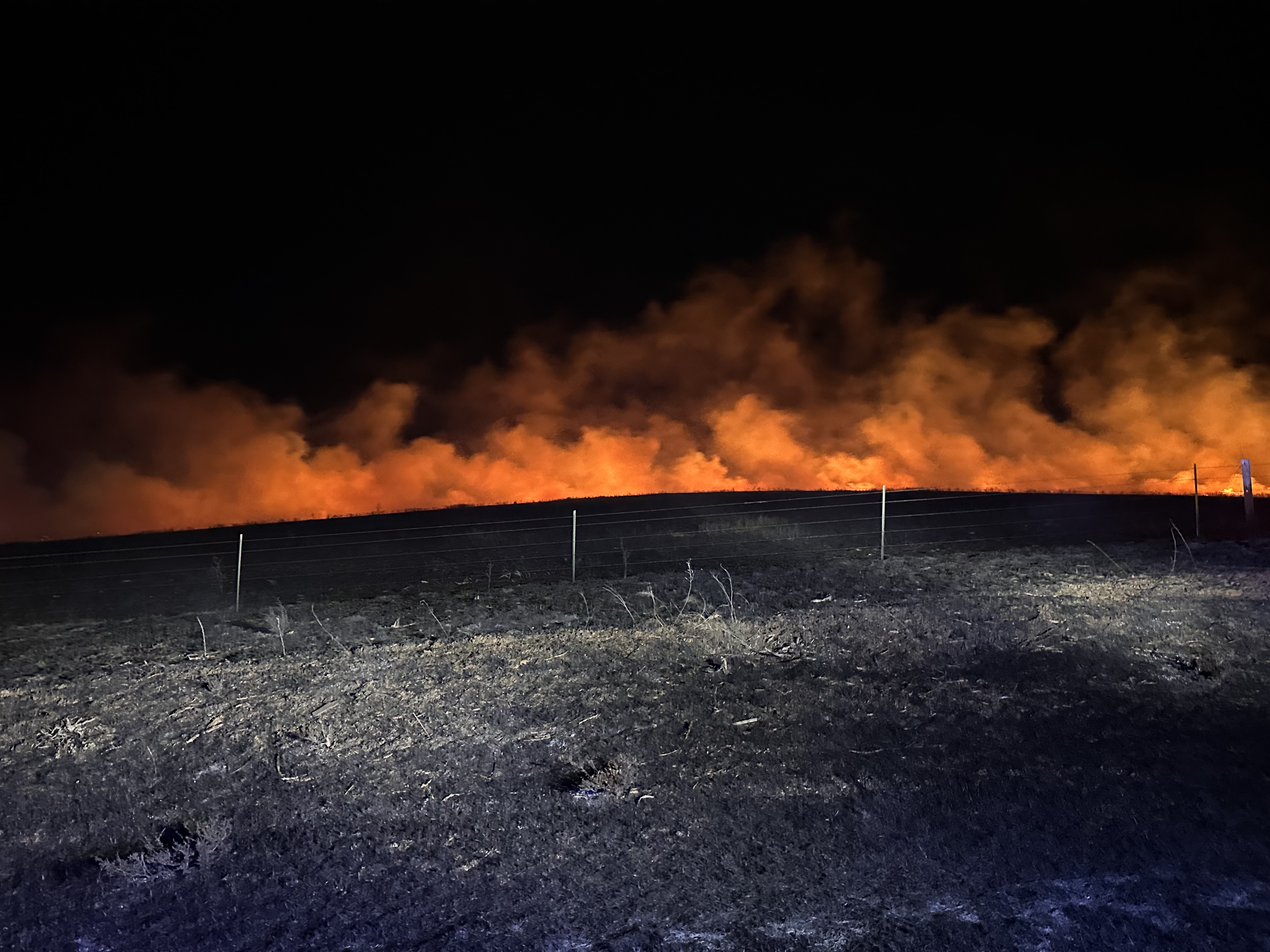 Garbage Truck Fire Sparks Grass Fire on South Burma Road Friday