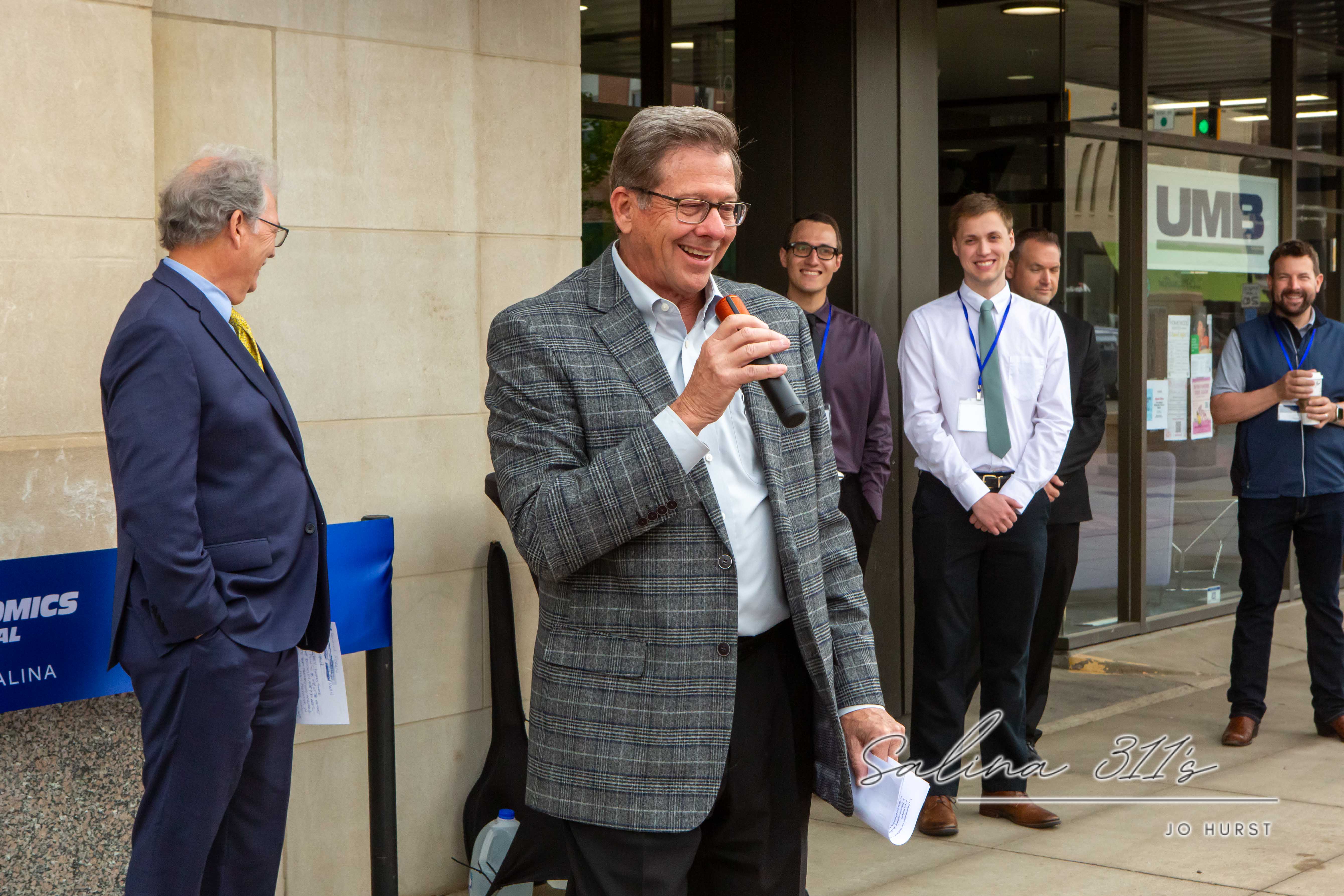 Salina Mayor Mike Hoppock speaks during Thursday’s ribbon cutting for General Atomics Aeronautical Systems, Inc.’s new downtown office at 100 S. Santa Fe.